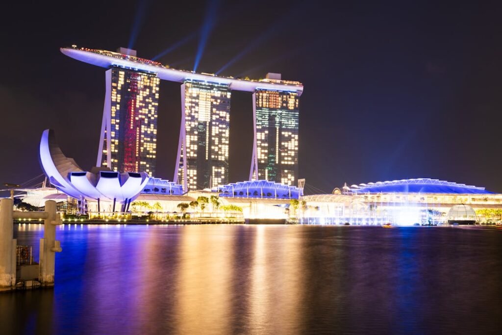 Iconic Marina Bay Sands Skypark infinity pool with panoramic Singapore skyline and Gardens by the Bay views"