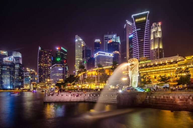 Iconic Singapore skyline featuring Marina Bay Sands, Supertree Grove, and the Singapore Flyer